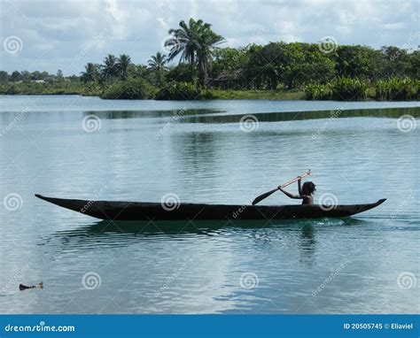 A Solo Vision: A Child Steering Through the Waves in a Canoe