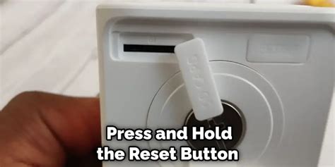 Step 3: Pressing and Holding the Reset Button