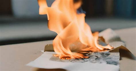 The Symbolism of Burning Paper in a Graveyard