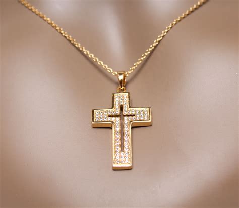 Unveiling the Symbolism Behind an Enchanting Golden Cross Pendant in Dreams