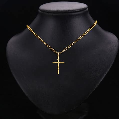 Why Must-Have Accessories Include Small Crucifix Pendants in Gold